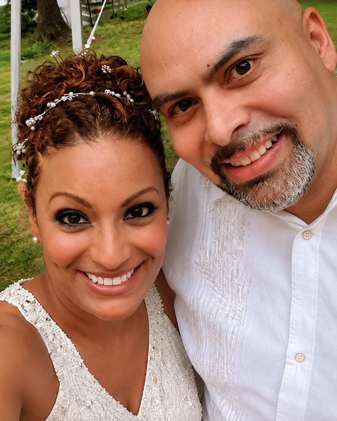 Couple smiling together at a Strike A Pose anniversary celebration